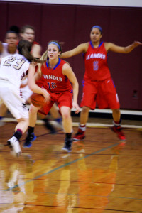 Seniors Michelle Madrigal and Kiahna Thompson play defense against the Rouse Lady Raider